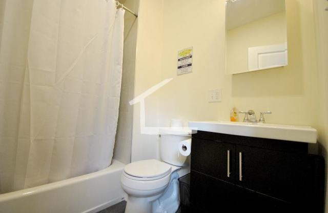 Nicely renovated Townhouse in a prime location near the Green Line with parking included! Gallery 4