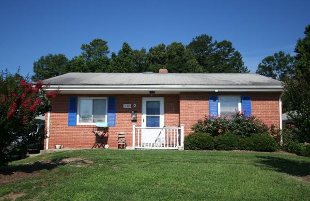 Two bedrooms, hardwood throughout, and a private driveway — all under $1,400 near Duke West. photos photos