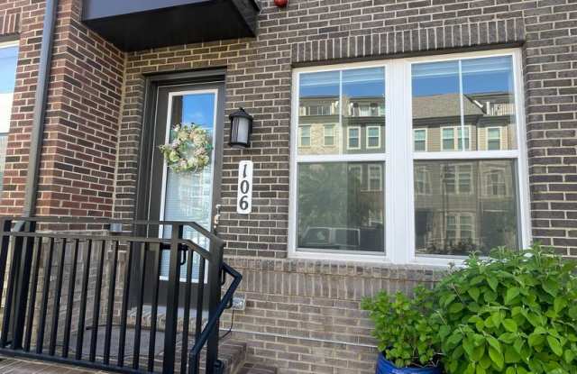 FOUR LEVEL TOWNHOUSE IN DOWNTOWN CROWN, 2 CAR GRARGE, 4 BEDROOMS AND 3.5 BATHS - 106 Dickenson Drive, Gaithersburg, MD 20878