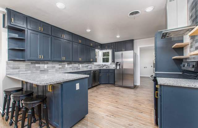 Renovated 3 Bed / 2 Bath Brick Home with 2-Car Garage & Fenced Yard in North Temple photos photos