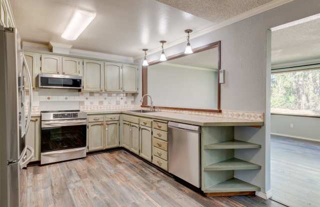 Spacious 4-Bedroom Home with Fireplace, Fenced Yard, and 2-Car Garage - 830 Cathlamet Drive, Oak Harbor, WA 98277