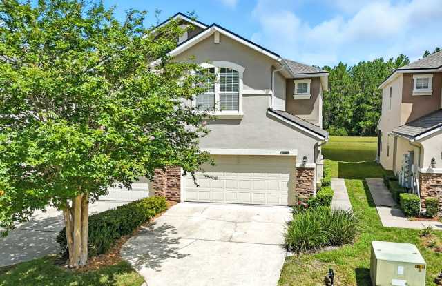 Immaculate three-bedroom, three-bath end-unit townhome showcasing upgrades throughout. photos photos