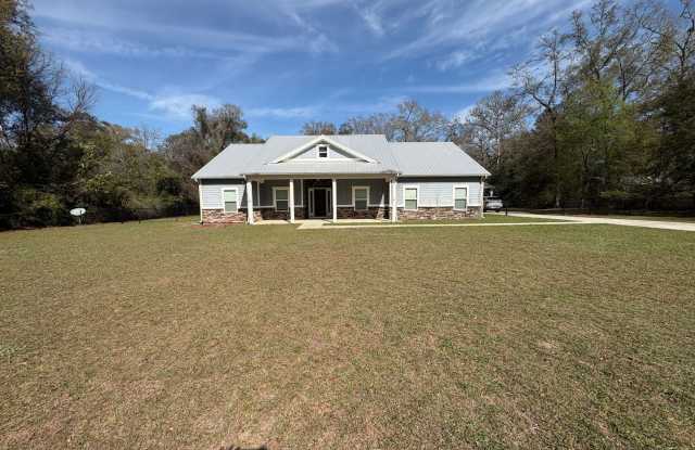 Available Now: Expansive 4BR Home with Rare 3-Bay Carport photos photos