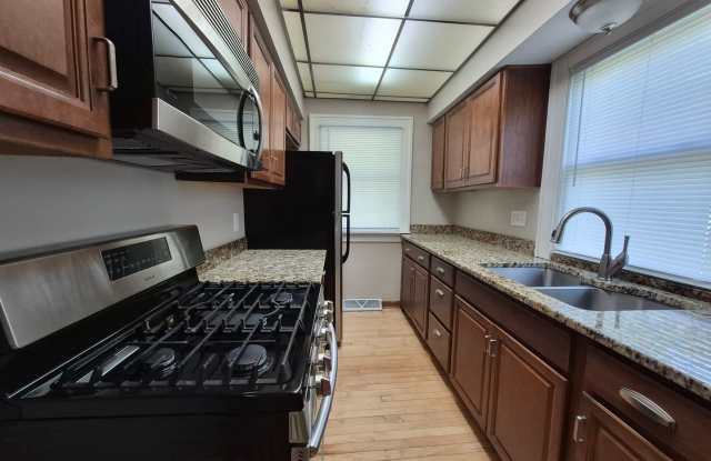 Fully fenced yard with stainless steel appliances including gas stove! Gallery 1