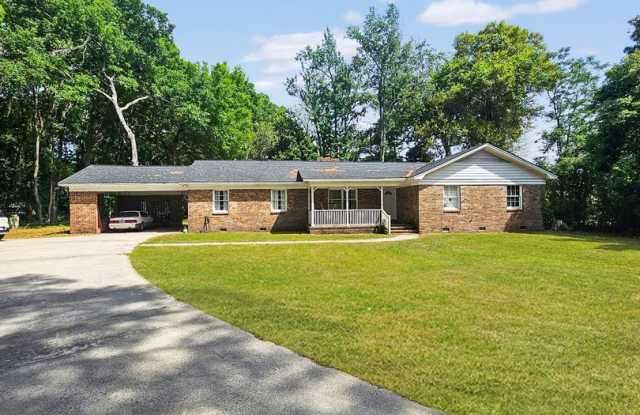 Charming brick home in beautiful Savannah offering four bedrooms and 2.5 bathrooms, Prime location! photos photos