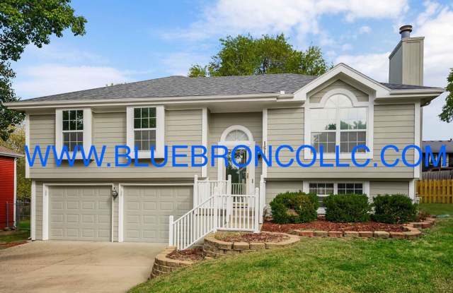 Check out this spacious home with thoughtful upgrades and flexible living! - 1610 Roberta Drive, Raymore, MO 64083