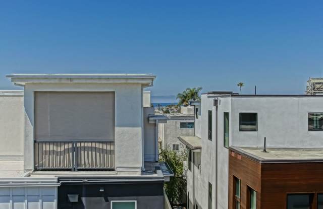 Custom, Modern  Spacious Tri-Level Home w/ Amazing Great Room Living Space, 4 Balconies/Decks, Ocean Views  2-Car Garage Close to Schools, Restaurants, Shopping  Just 4 Blocks to Beach! Gallery 4