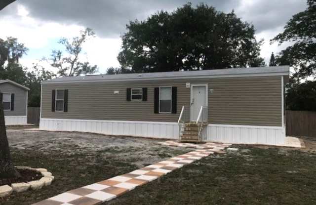 Two-bedroom Home with Water, Garbage, and Lawncare Included photos photos