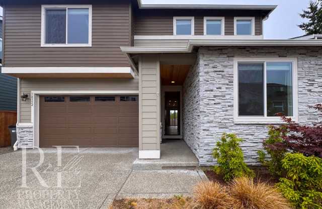 Naturally Lit 5-Bedroom Home with Fireplace, Main-Level Bedroom & Fenced Backyard photos photos