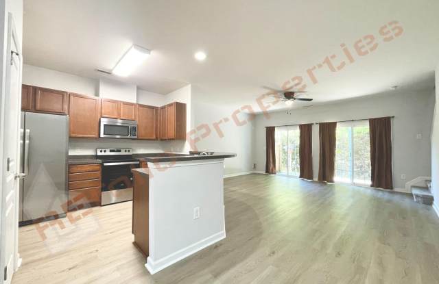 Welcome to this 3-bedroom, 2.5-bathroom, 1-car garage end-unit townhome in Davis Village, Cary, Available Now! Gallery 3