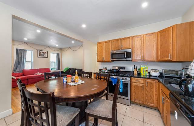 Fully renovated 5 bedroom unit on Mission Hill with a deck and shared backyard! photos photos