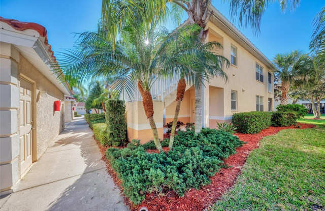 Elegant 3 Bedroom End-Unit Condo with Screened Lanai & Pond Views and A Private Garage photos photos