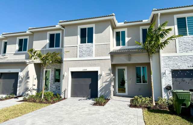 Indulge in luxury living with this elegant brand new 3 bed 3.5 bath Townhouse with yard, garage and impact-resistant windows within Luxurious Community Terra Sol photos photos