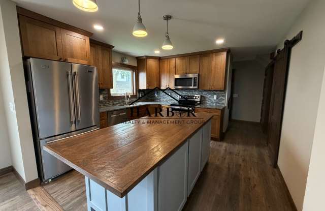 *1/2 Off First Months Rent* Spacious 3BR Home with 2-Stall Garage & Private Deck in Kasson photos photos
