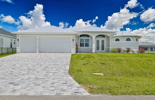 NOW AVAILABLE - Gorgeous Pool Home ~ NW Cape ~ 3 Car Garage ~ On Canal! photos photos