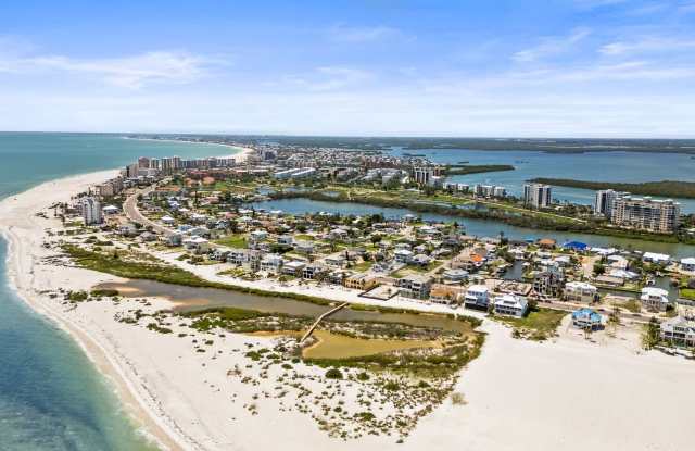 Fully renovated, three-bedroom, two-bathroom gem with New pool/tub and beach access in FMB photos photos