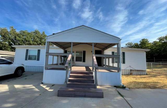 3 bedroom 2 bath Mobile home newly updated and ready for move in! Located in Newalla on a beautiful lot, plenty of trees , covered parking and storage buildings! Pets considered! photos photos