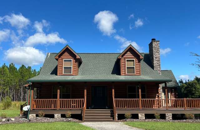Gorgeous 3-Bedroom Log Cabin with Loft, Large Shop  Stocked Pond – Near Branford, FL photos photos