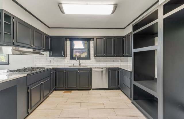 Newly renovated home with a large yard perfect for BBQ's and Game-day! - 564 South 87th East Avenue, Tulsa, OK 74112