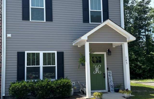 This spacious 3-bedroom, 2-bathroom townhouse offers modern living photos photos