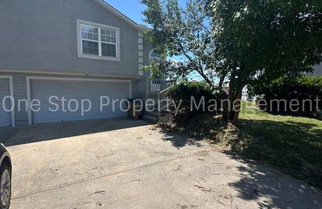 Spacious 3 Bed, 3 Bath Home in Raymore with Deck, Fenced Yard, and 2 Car Garage photos photos