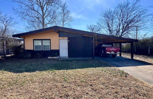 Charming 3-bedroom, 1-bath home featuring an attached carport and a fully fenced backyard—perfect for privacy and outdoor enjoyment. photos photos