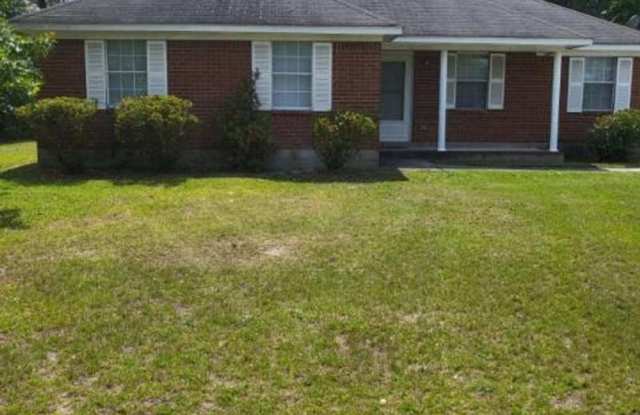 Single family home with covered front porch and back patio. photos photos