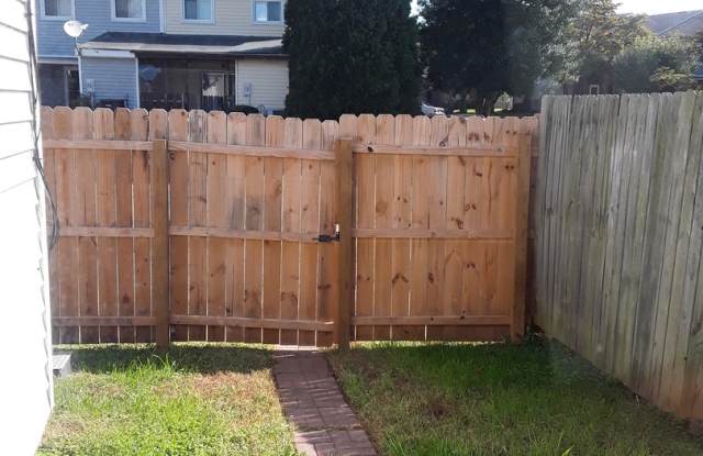 Three bedroom townhome with small, fenced-in patio/ yard area. photos photos