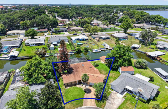 Available Now! Unique Canal-Front Pool Home with Boathouse & Chain of Lakes Access Gallery 3