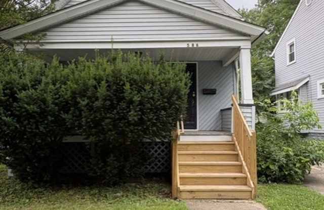 Updated West Akron Home with Flexible Living Space, Large Yard & Garage photos photos