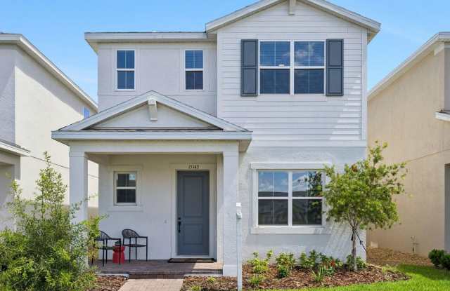 This charming 4 Bedroom, 3 Bath Single Family Home For Rent at 15143 Blue Peacock Lane Winter Garden, FL 34787. photos photos