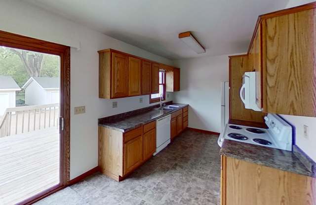 Huge 24' x 28' garage, two story duplex with two large bedrooms, one and a half bath, full basement, 12x18 deck, lawn and snow provided. photos photos