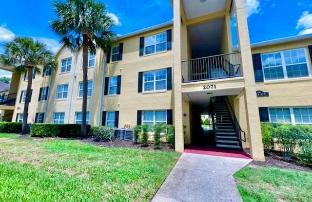 MOVE IN NOW!! Gated community Miriada! 1st floor 1X1.5 bath condo near pool area!!! Laminate wood flooring in living area and carpet in bedroom! Has washer & dryer! Gas stove & water heater! photos photos