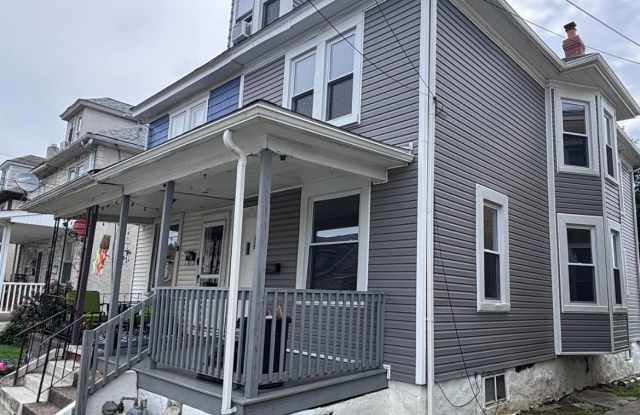 Twin home with updated kitchen, washer/dry on first floor, private back yard and porch. photos photos