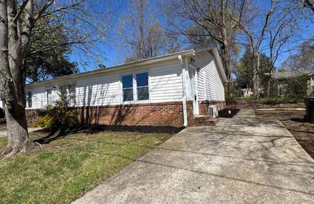 End Unit of Tri-Plex - in downtown Greer - 1 BD, 1 full BA, Nice Size Den, Kitchen with new appliances - Stove, Refrig.  Stacked Washer  Dryer. LVP Flooring, New Windows  New Heat/Air. photos photos