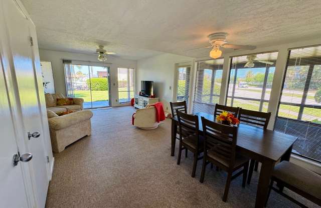 FULLY FURNISHED 2-Story Townhouse on Canal – Pool, Golf Views & ALL Utilities Included! Gallery 1