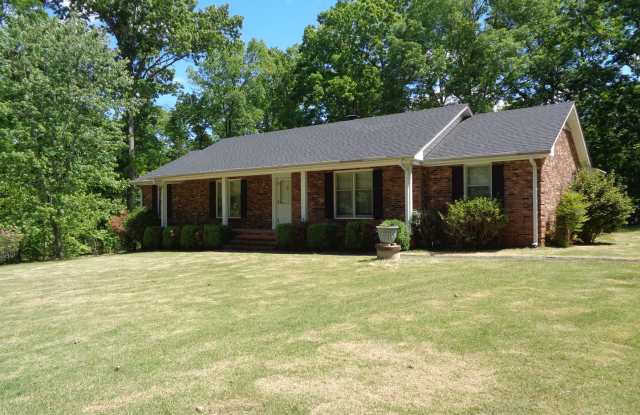 Remodeled Brick Rancher With a Screened Porch and Double Detached Garage Near Forest Oaks photos photos