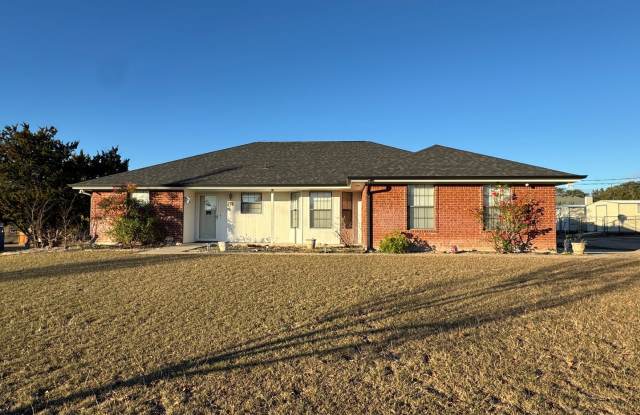 Charming 3-bedroom, 2-bath home offering peaceful country living on just under an acre. photos photos