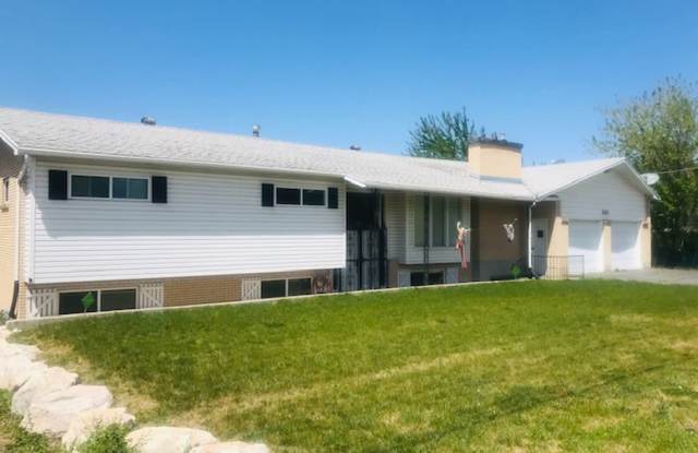 Beautiful home with large rooms and large windows, New carpet and paint throughout this 5000 Square foot home - 2123 North 2000 West, Clinton, UT 84015