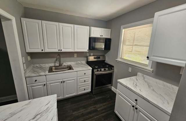 3-Bedroom, 1.5-Bath Townhome with Finished Basement & Central A/C Gallery 1