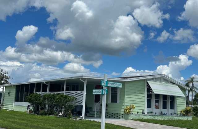 Updated Coastal 2BR/2BA Corner Lot Home in Gated 55+ Resort Gallery 1
