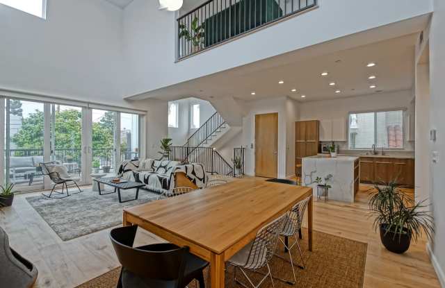 Custom, Modern  Spacious Tri-Level Home w/ Amazing Great Room Living Space, 4 Balconies/Decks, Ocean Views  2-Car Garage Close to Schools, Restaurants, Shopping  Just 4 Blocks to Beach! photos photos