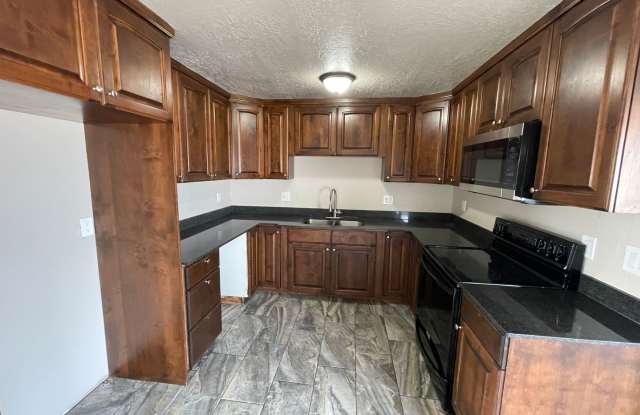 Spacious 6-Bedroom Magna Home with Fenced Yard photos photos