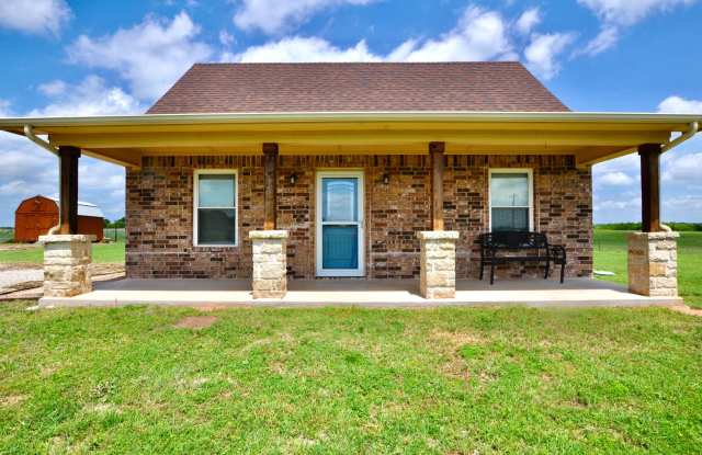 FOR LEASE! Enjoy Quiet Country Living in this Cute 2 BR - 1 BA Brick Home on 1 Acre in Millsap ISD. photos photos