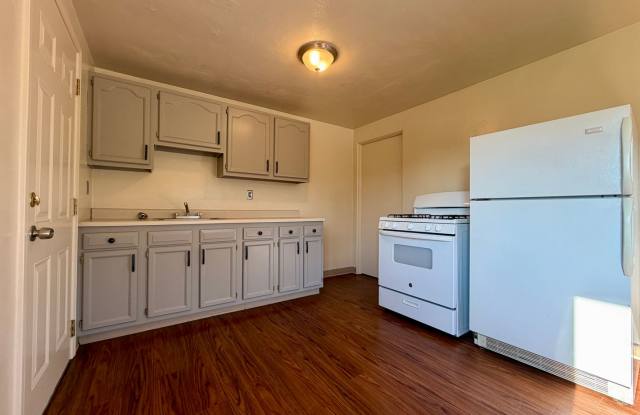 Charming Two Bedroom Townhome with a Private Basement & a Shared Backyard Space! Call Today! Gallery 1