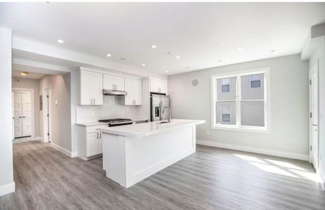 Stunning 2 Bd 1.5 Bath with Garage Parking Included minutes to North Quincy T, Available Now. photos photos