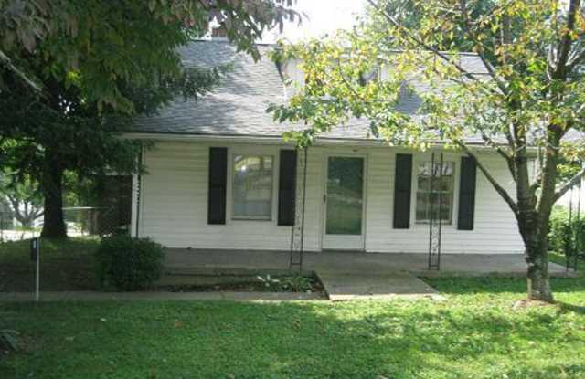 Country charm in the city with large fenced yard and covered front porch 260218 photos photos Country charm in the city with large fenced yard and covered front porch 260218 photos photos