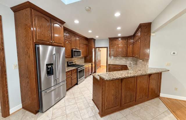 Spacious 7-Bedroom, 4-Bath Home with Finished Basement, Sunroom & Outdoor Kitchen Gallery 4