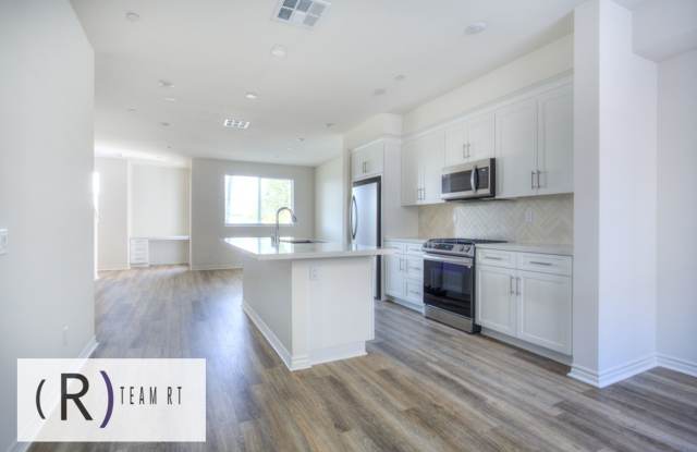 Modern 4-Bedroom Tri-Level Home with EV Charging & Solar in Artesia ! Gallery 3