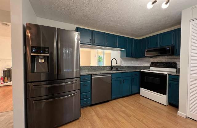 Welcome to this chic 3 bedroom end of group townhome in Queen Anne Village. Gallery 4